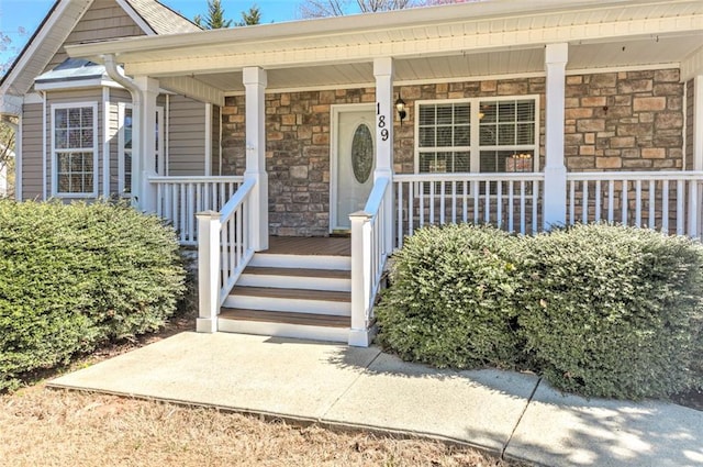 189 Meadow Spring Dr, Temple, GA 30179 - doorway to property featuring stone siding and covered porch