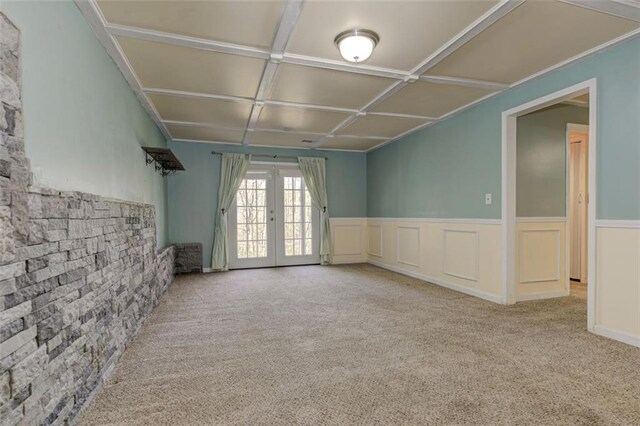 189 Meadow Spring Dr, Temple, GA 30179 - unfurnished living room with french doors, carpet flooring, coffered ceiling, and a wainscoted wall