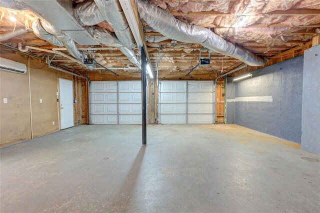 189 Meadow Spring Dr, Temple, GA 30179 - garage with a wall unit AC and a garage door opener