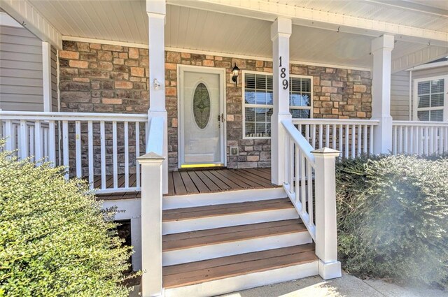 189 Meadow Spring Dr, Temple, GA 30179 - view of exterior entry featuring stone siding and a porch