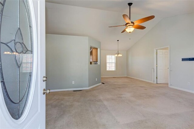 189 Meadow Spring Dr, Temple, GA 30179 - entrance foyer featuring baseboards, a ceiling fan, carpet, a chandelier, and high vaulted ceiling