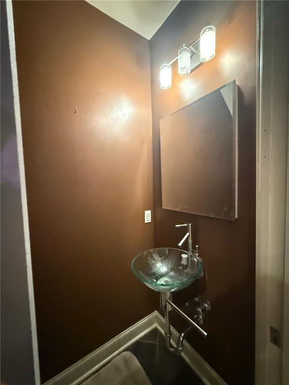 bathroom with tile patterned flooring and sink