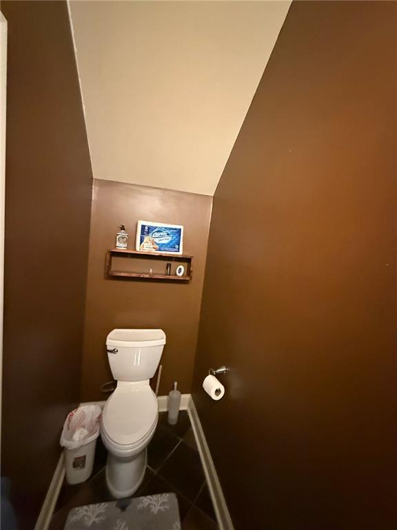 bathroom with tile patterned floors and toilet