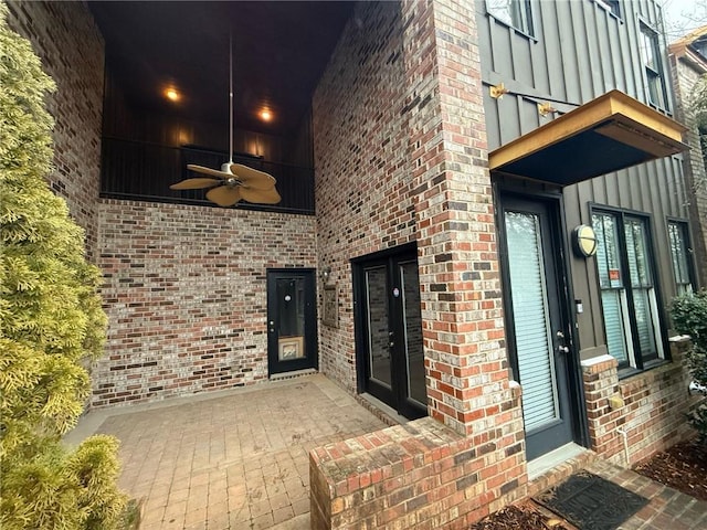 entrance to property featuring ceiling fan