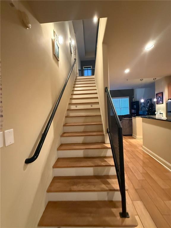 staircase featuring hardwood / wood-style flooring