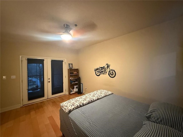 bedroom with access to exterior, french doors, ceiling fan, and light wood-type flooring