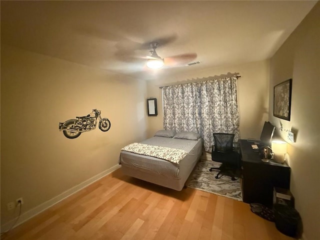 bedroom featuring ceiling fan and light wood-type flooring