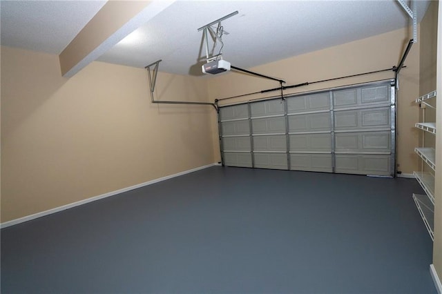 994 Rolling Forest Ln, Lilburn, GA 30047 - garage with a garage door opener and baseboards