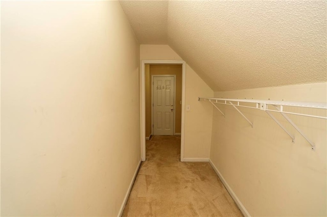 994 Rolling Forest Ln, Lilburn, GA 30047 - walk in closet featuring lofted ceiling and light carpet