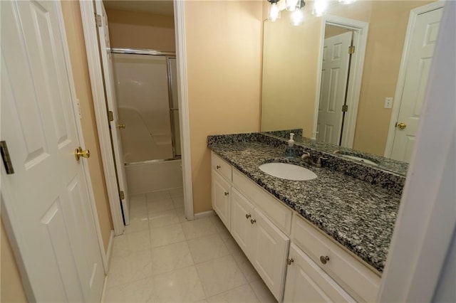 994 Rolling Forest Ln, Lilburn, GA 30047 - full bath featuring vanity, combined bath / shower with glass door, tile patterned floors, and baseboards