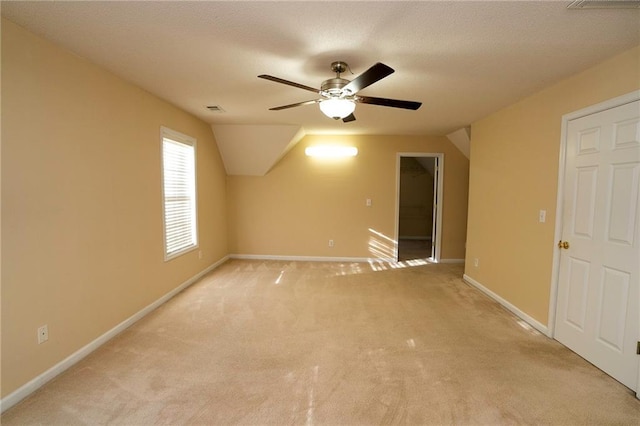 994 Rolling Forest Ln, Lilburn, GA 30047 - spare room featuring a ceiling fan, light carpet, baseboards, and lofted ceiling