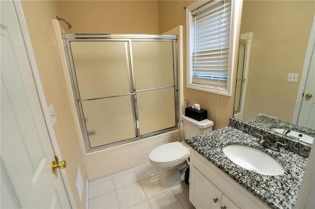 994 Rolling Forest Ln, Lilburn, GA 30047 - bathroom featuring combined bath / shower with glass door, vanity, toilet, and tile patterned floors