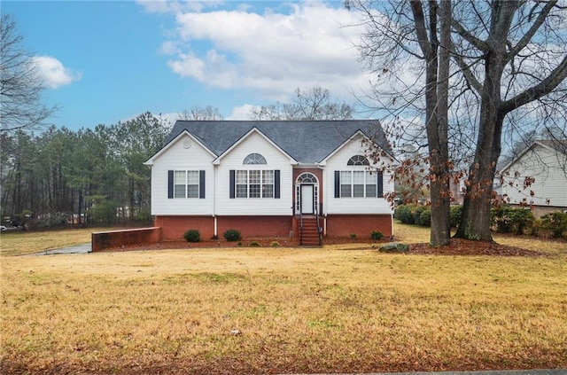 split foyer home featuring a front lawn