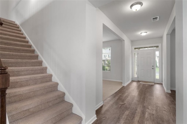 2537 Sori Dr, Buford, GA 30519 - entrance foyer with wood finished floors, stairway, and baseboards