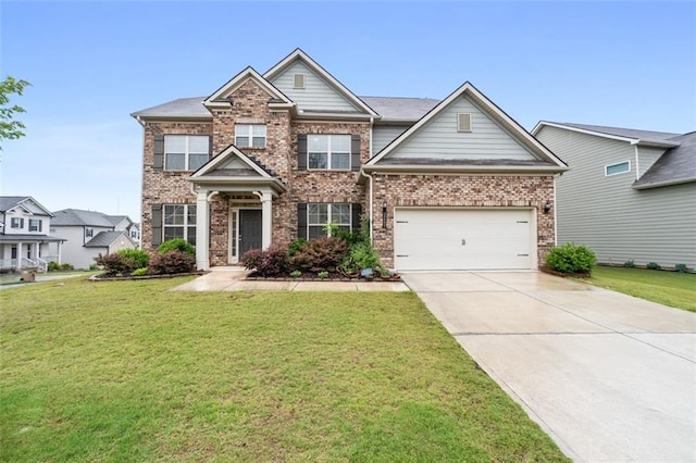 2537 Sori Dr, Buford, GA 30519 - view of front of house with concrete driveway, a front yard, and brick siding