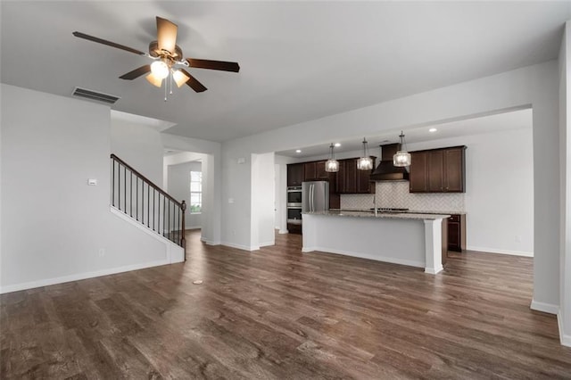 2537 Sori Dr, Buford, GA 30519 - unfurnished living room with dark wood-style floors, a ceiling fan, stairway, baseboards, and recessed lighting
