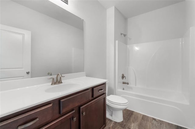 2537 Sori Dr, Buford, GA 30519 - bathroom with vanity, wood finished floors, toilet, and shower / washtub combination