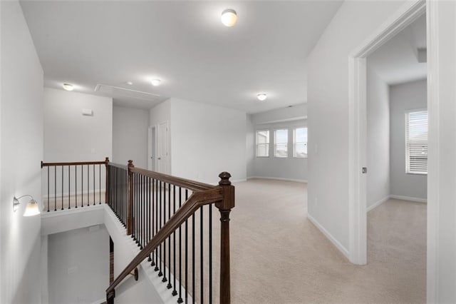 2537 Sori Dr, Buford, GA 30519 - hallway featuring an upstairs landing, attic access, carpet floors, and baseboards