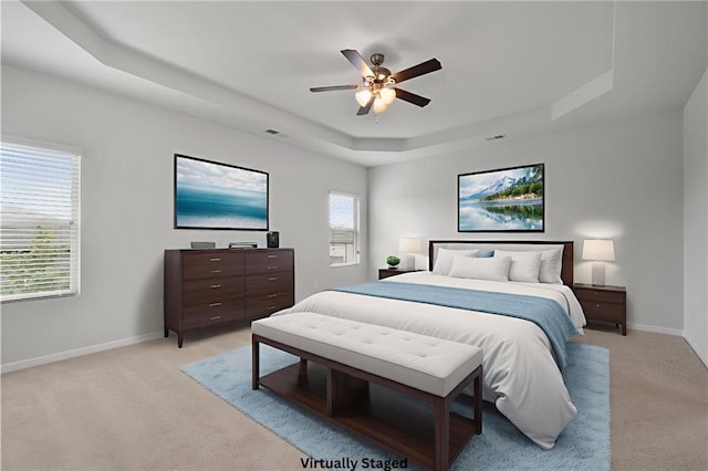 2537 Sori Dr, Buford, GA 30519 - bedroom featuring a tray ceiling, light colored carpet, baseboards, and ceiling fan