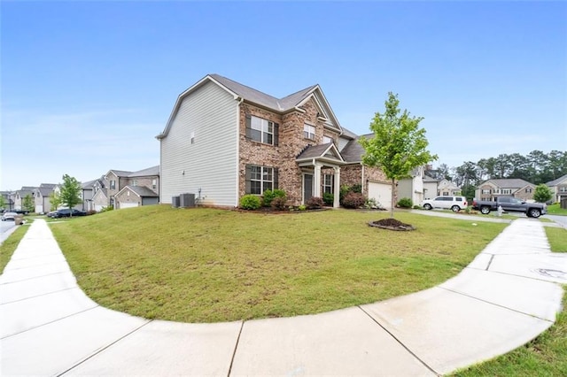 2537 Sori Dr, Buford, GA 30519 - view of front of property featuring a front yard, a residential view, brick siding, and central air condition unit
