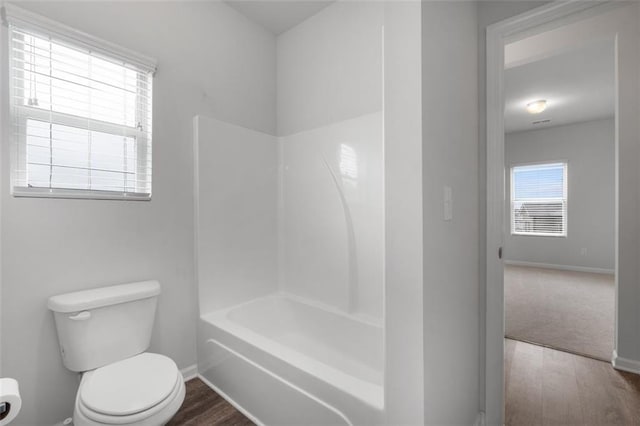 2537 Sori Dr, Buford, GA 30519 - full bath with toilet, baseboards, wood finished floors, and shower / bathtub combination