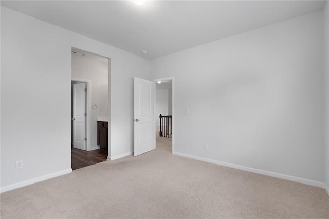 2537 Sori Dr, Buford, GA 30519 - unfurnished bedroom featuring carpet flooring, baseboards, and ensuite bathroom