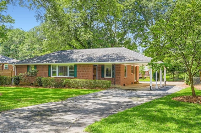 739 Pinehill Dr SE, Smyrna, GA 30080 - ranch-style home featuring driveway, a front lawn, brick siding, and a carport