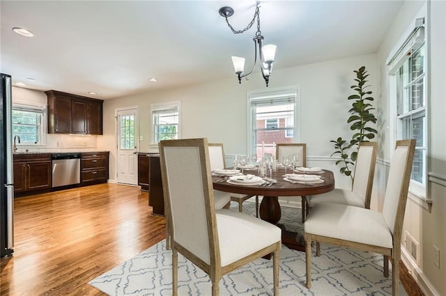 739 Pinehill Dr SE, Smyrna, GA 30080 - dining room featuring light wood-style flooring, a chandelier, and recessed lighting