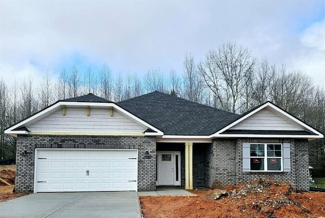 ranch-style home with a garage, concrete driveway, brick siding, and roof with shingles