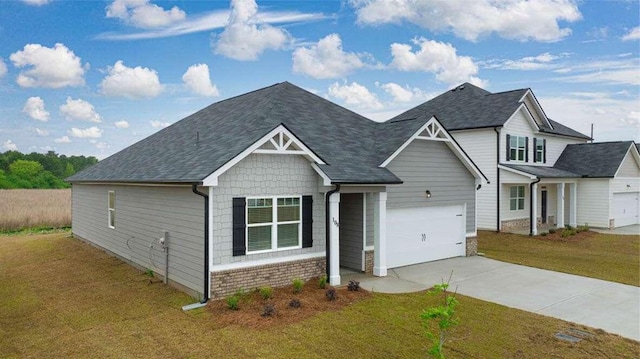 view of front of house with a front lawn and a garage