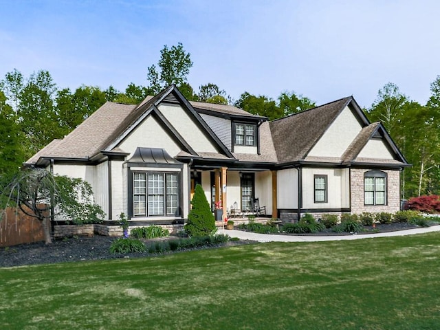 1076 Pinyan Ln, Canton, GA 30115 - view of front of house with covered porch, a front lawn, and a shingled roof