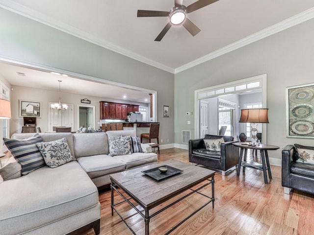 1076 Pinyan Ln, Canton, GA 30115 - living area with a chandelier, crown molding, light wood-type flooring, and ceiling fan