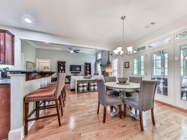 1076 Pinyan Ln, Canton, GA 30115 - dining space with a chandelier, light wood finished floors, a ceiling fan, recessed lighting, and ornamental molding