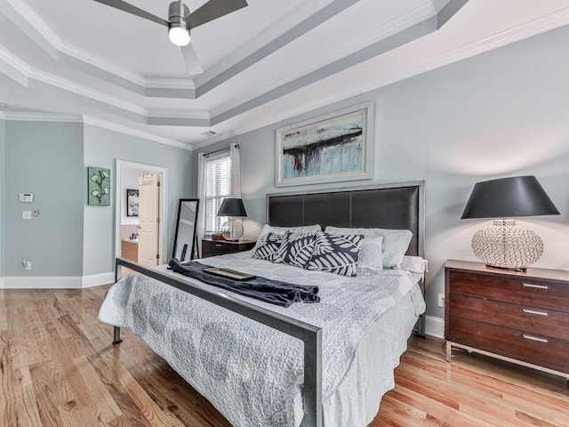 1076 Pinyan Ln, Canton, GA 30115 - bedroom with a tray ceiling, wood finished floors, ornamental molding, and ceiling fan