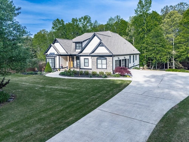 1076 Pinyan Ln, Canton, GA 30115 - view of front of house with stone siding, a front lawn, concrete driveway, and view of wooded area