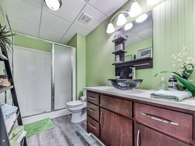 1076 Pinyan Ln, Canton, GA 30115 - bathroom with a paneled ceiling, a shower stall, vanity, and wood finished floors