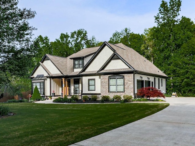 1076 Pinyan Ln, Canton, GA 30115 - view of front facade with stone siding, a front lawn, covered porch, and driveway