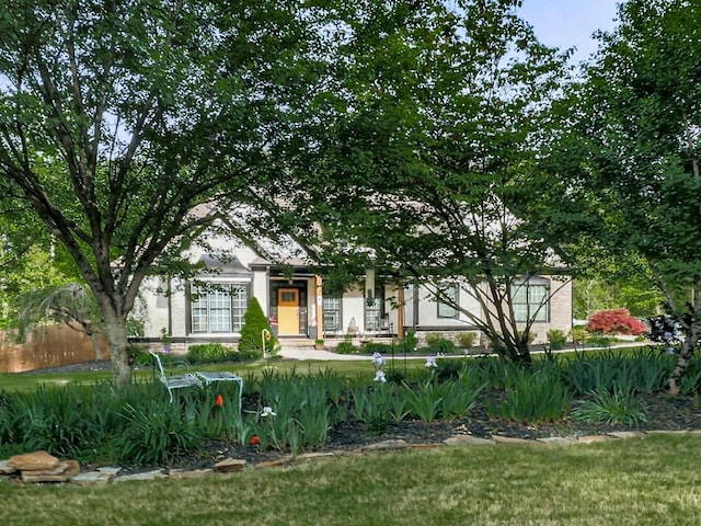 1076 Pinyan Ln, Canton, GA 30115 - view of property hidden behind natural elements featuring stucco siding and a front yard