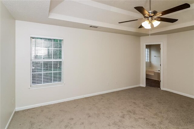137 Legend Creek Dr, Canton, GA 30114 - empty room featuring carpet floors, a raised ceiling, and healthy amount of natural light