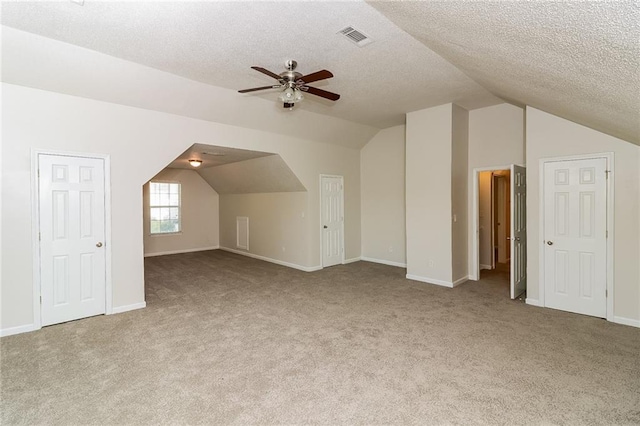 137 Legend Creek Dr, Canton, GA 30114 - additional living space featuring vaulted ceiling, ceiling fan, carpet flooring, baseboards, and a textured ceiling