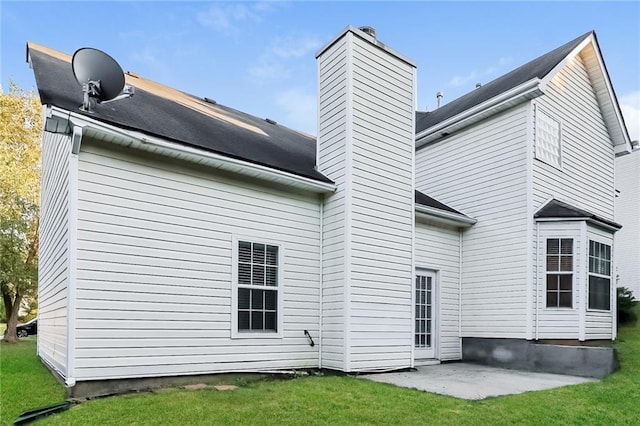 137 Legend Creek Dr, Canton, GA 30114 - rear view of property with a chimney, a patio area, and a yard