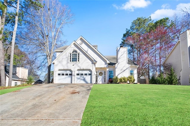 view of front facade featuring a garage, stucco siding, driveway, and a front lawn