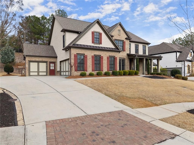 craftsman-style house with a garage, a front lawn, and covered porch