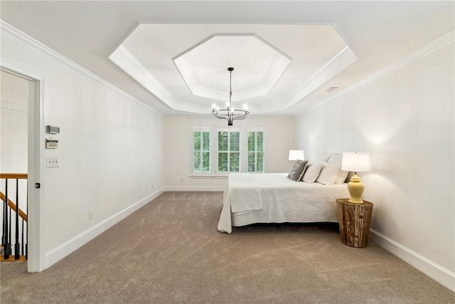 bedroom with a tray ceiling, ornamental molding, and carpet flooring