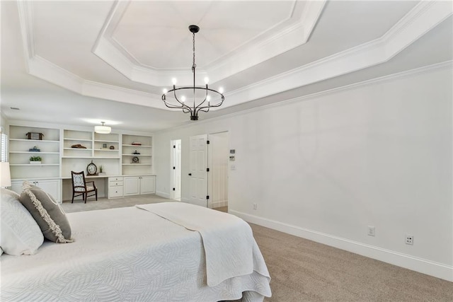 bedroom with crown molding, light carpet, a tray ceiling, and a chandelier