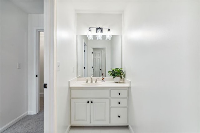 bathroom featuring baseboards and vanity