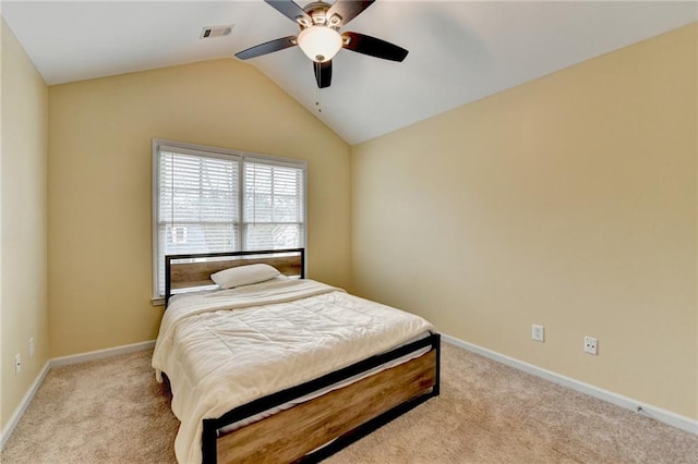 bedroom with vaulted ceiling, light carpet, and ceiling fan