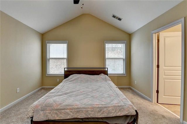 carpeted bedroom featuring vaulted ceiling and ceiling fan