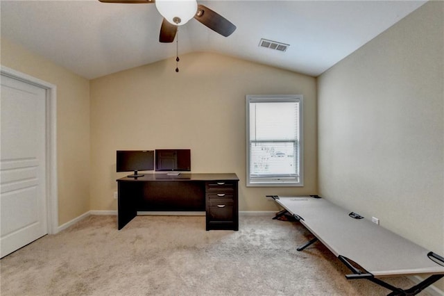 home office featuring ceiling fan, light colored carpet, and lofted ceiling