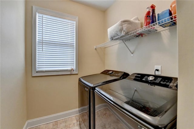 laundry room with separate washer and dryer